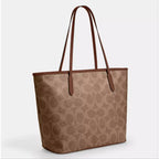 Inspire designer coa,ch  reversible bag